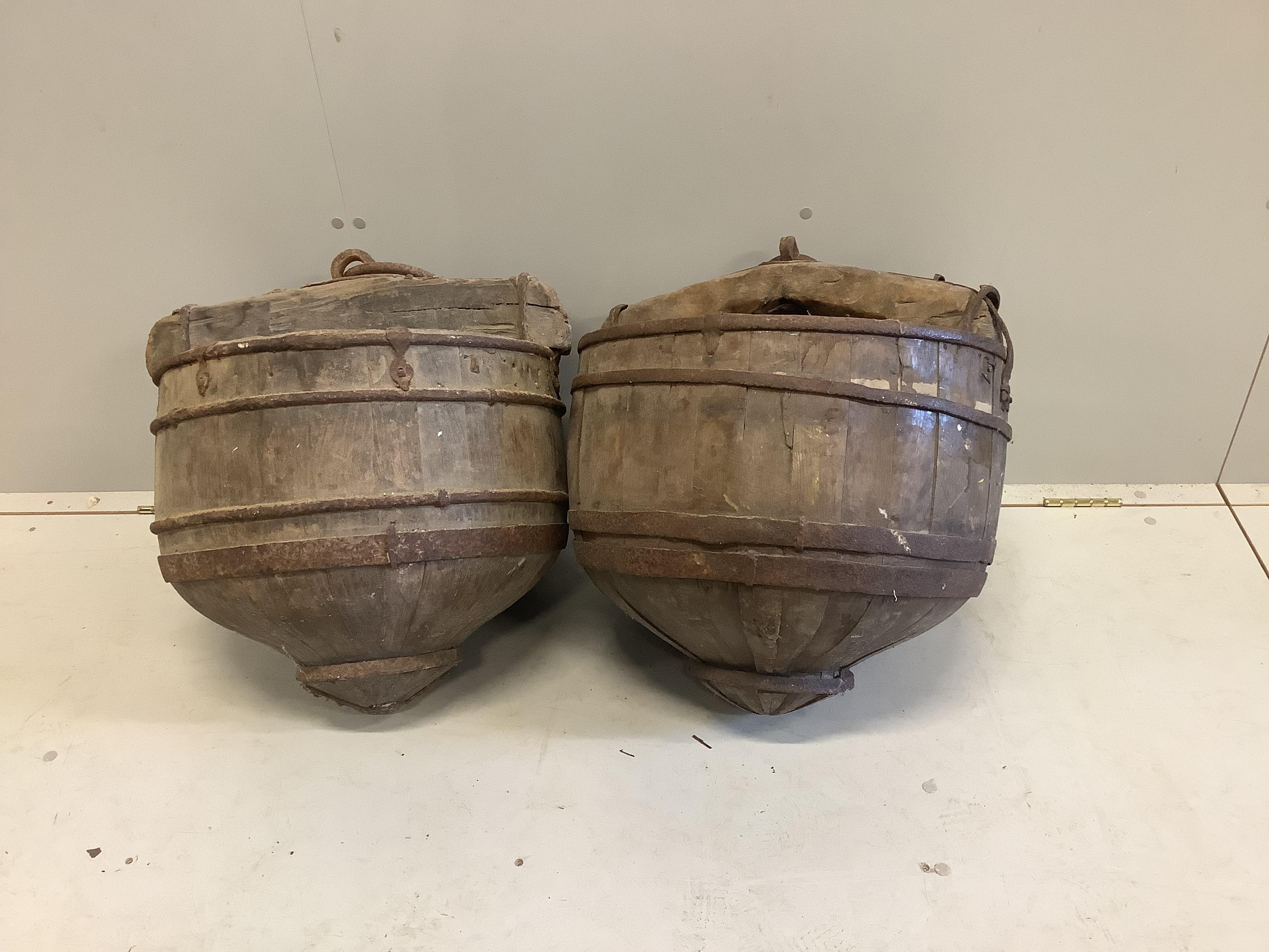 A pair of Eastern iron bound staved hardwood well buckets, diameter 48cm, height 50cm